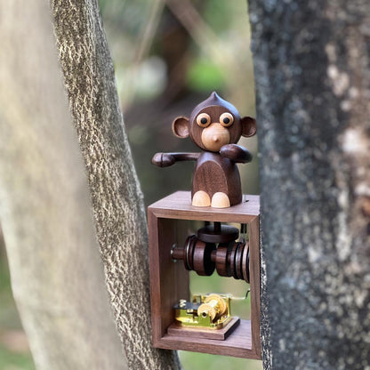 Handgefertigte Spieluhr aus Holz mit Handkurbel und Affenmotiv (Melodie „Das Schloss im Himmel“)