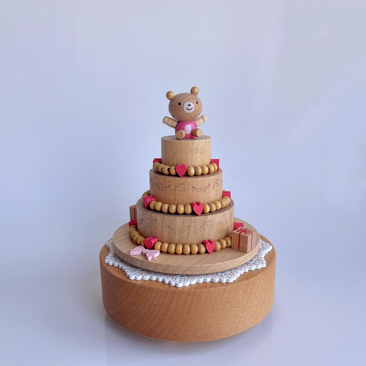 Drehende Spieluhr mit Geburtstagstorte und Bär (Melodie „Happy Birthday“)